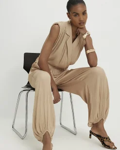 Beige Satin Shoulder Pad Balloon Leg Jumpsuit
