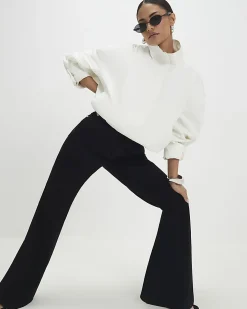 Petite Black High Rise Relaxed Flare Jeans