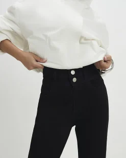 Petite Black High Rise Relaxed Flare Jeans